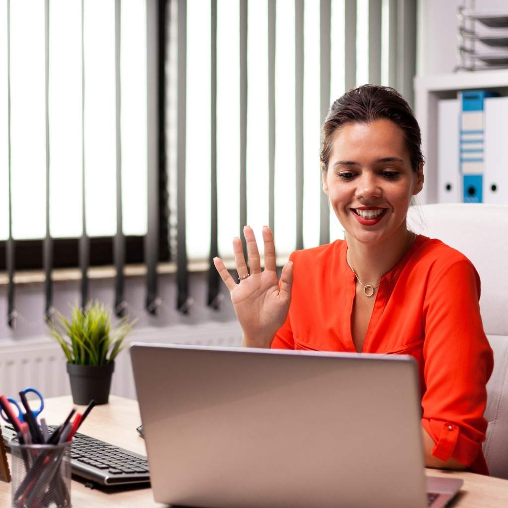 BizBackerz female virtual assistant talking to real estate client on laptop